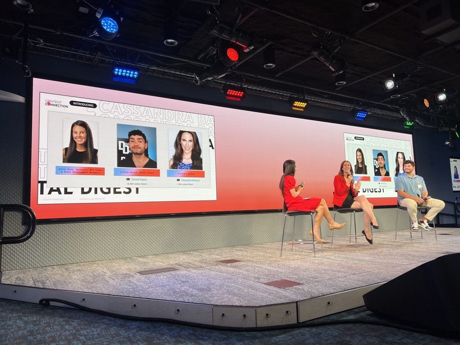 Wide view of YouTube's Content Connection stage in Chicago with the speaker panel and screen